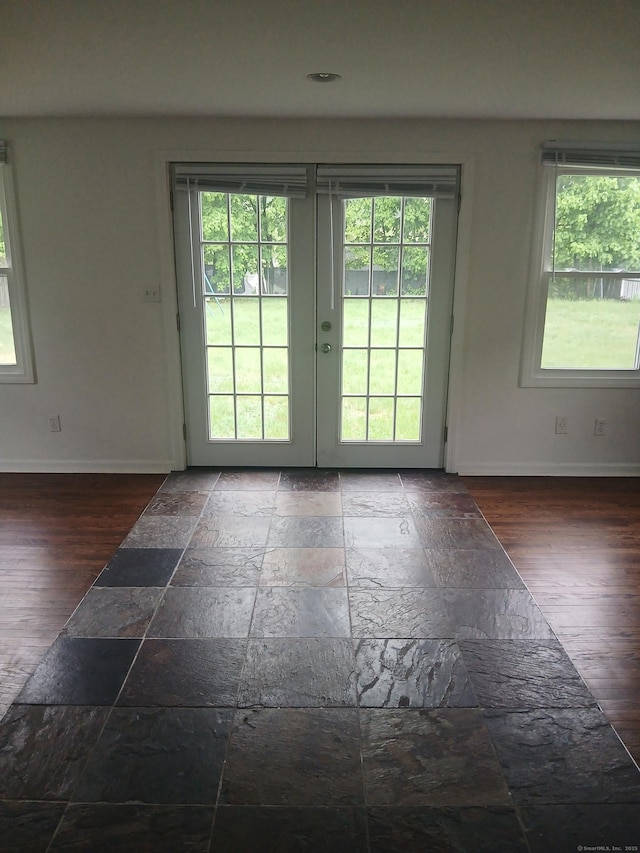 22 Bristol St, Wallingford, CT 06492 - entryway with french doors, baseboards, a healthy amount of sunlight, and stone tile flooring