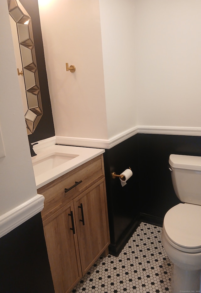 22 Bristol St, Wallingford, CT 06492 - half bath with toilet, tile patterned flooring, and vanity
