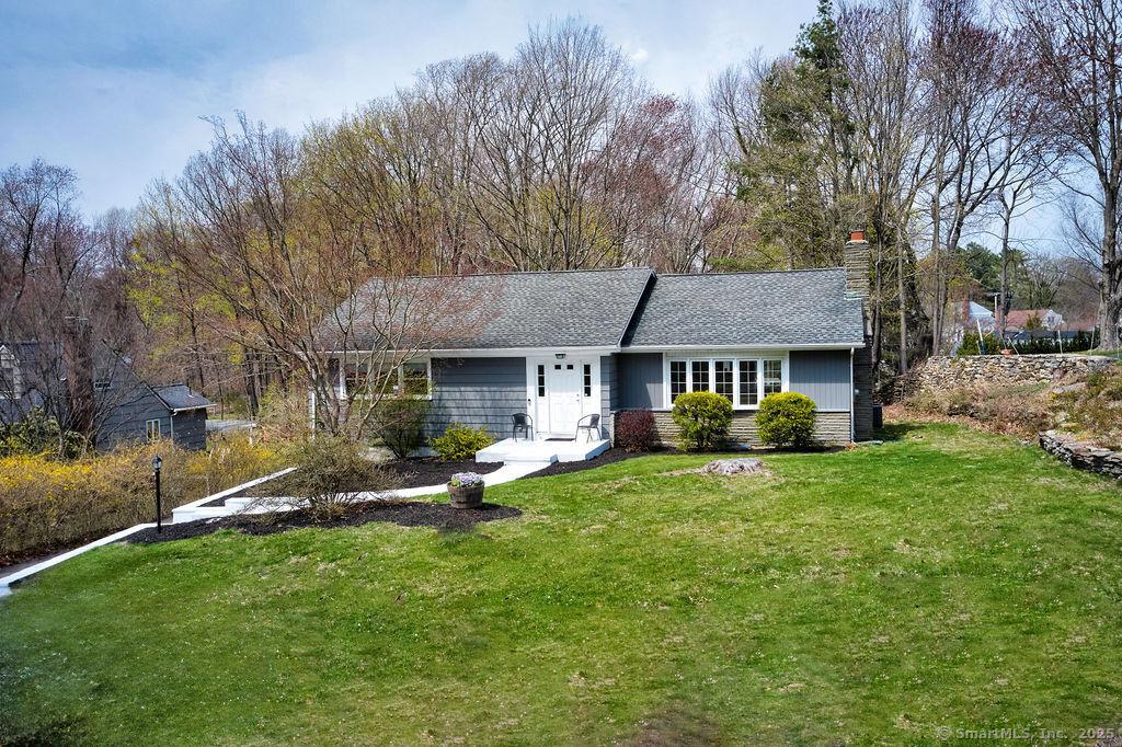 150 Lake Ave, Trumbull, CT 06611 - ranch-style house with a front yard, a shingled roof, and a chimney