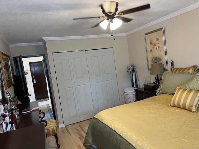 3699 Broadbridge Ave Unit 234, Stratford, CT 06614 - bedroom with light wood finished floors, a ceiling fan, a closet, and ornamental molding
