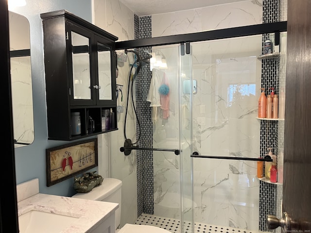3699 Broadbridge Ave Unit 234, Stratford, CT 06614 - bathroom featuring toilet, vanity, and a marble finish shower