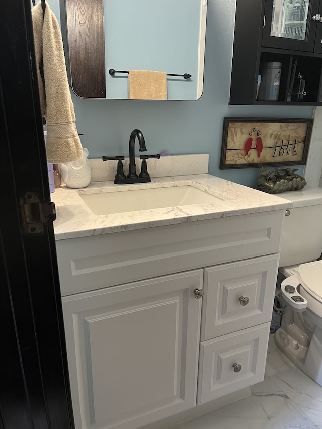 3699 Broadbridge Ave Unit 234, Stratford, CT 06614 - bathroom with toilet, vanity, and marble finish floor