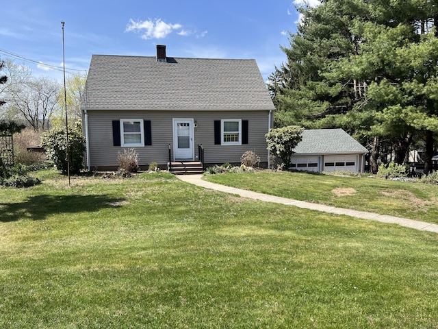cape cod home featuring roof with shingles, a chimney, and a front lawn