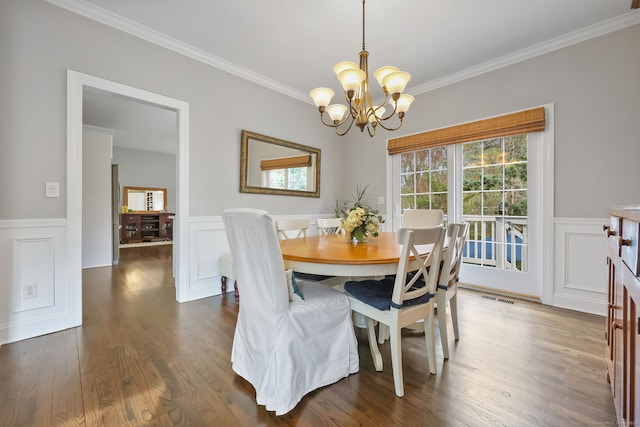 12 Canoe Brook Rd, Trumbull, CT 06611 - dining room with a notable chandelier, a wainscoted wall, visible vents, a decorative wall, and ornamental molding