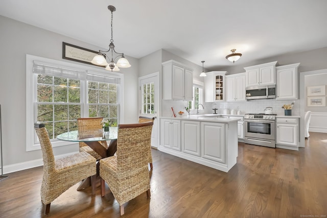 12 Canoe Brook Rd, Trumbull, CT 06611 - kitchen featuring glass insert cabinets, backsplash, appliances with stainless steel finishes, and light countertops