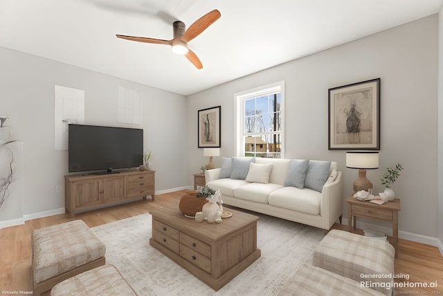 living room featuring light wood finished floors, baseboards, and ceiling fan