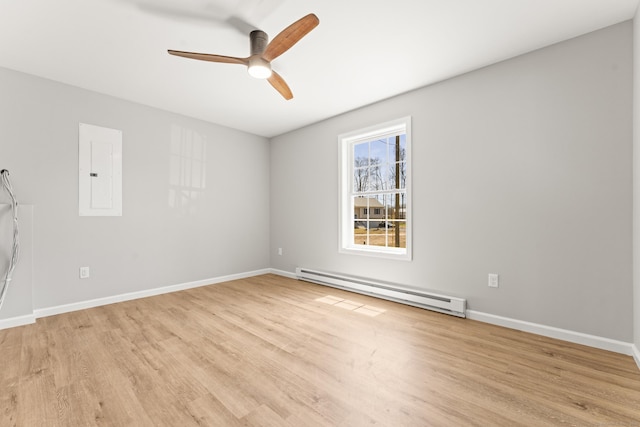empty room featuring a baseboard radiator, light wood-type flooring, baseboards, and ceiling fan