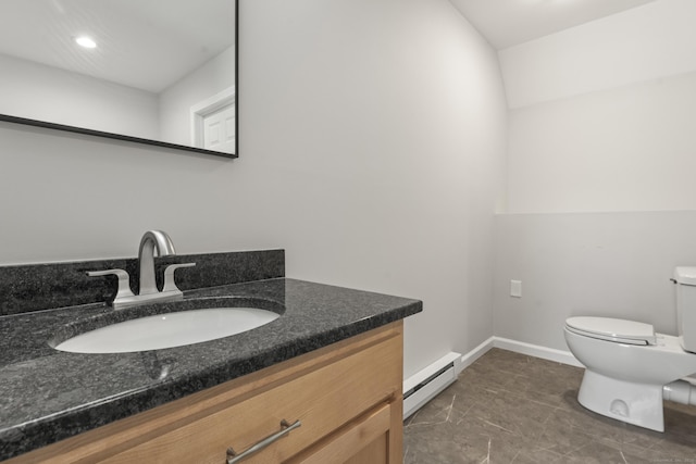 half bath featuring a baseboard heating unit, toilet, vanity, and recessed lighting