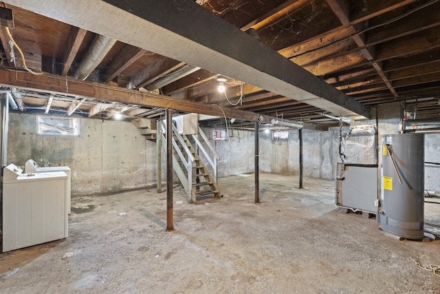 basement featuring stairway, washing machine and dryer, water heater, and heating unit