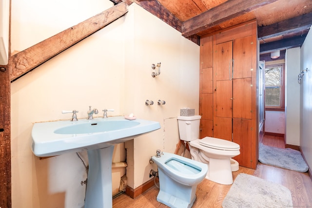 1156 Exeter Rd, Lebanon, CT 06249 - bathroom with toilet, a bidet, wood finished floors, and baseboards