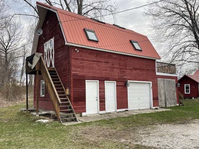 1156 Exeter Rd, Lebanon, CT 06249 - exterior space featuring driveway, metal roof, an attached garage, a gambrel roof, and stairs