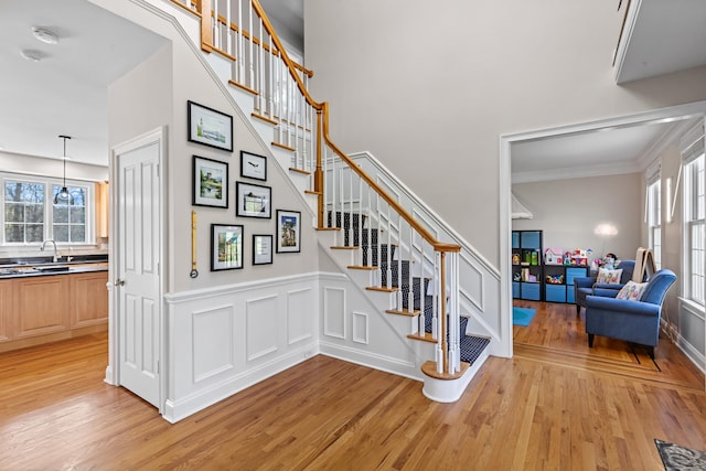 10 Granite Rd, New Milford, CT 06776 - stairway featuring ornamental molding, a wealth of natural light, and wood finished floors