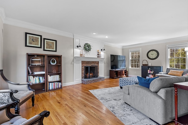 10 Granite Rd, New Milford, CT 06776 - living room featuring baseboards, crown molding, a brick fireplace, and light wood-type flooring