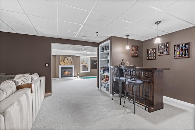 10 Granite Rd, New Milford, CT 06776 - bar featuring a drop ceiling, carpet, a glass covered fireplace, baseboards, and a dry bar