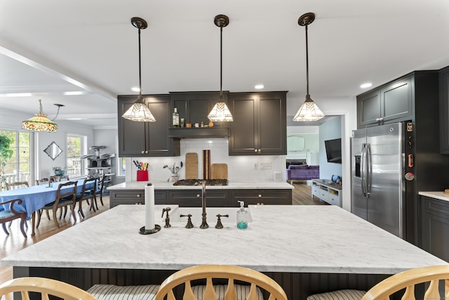 11 Knollwood Dr, Newtown, CT 06470 - kitchen with recessed lighting, appliances with stainless steel finishes, a breakfast bar, and tasteful backsplash