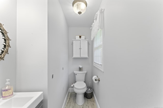 11 Knollwood Dr, Newtown, CT 06470 - bathroom with baseboards, toilet, and wood finished floors