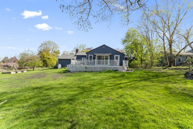 11 Knollwood Dr, Newtown, CT 06470 - back of house featuring a wooden deck, a yard, and a chimney