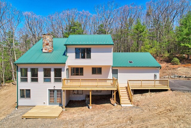 254 Wright Rd, Canton, CT 06019 - back of house with a deck, a metal roof, french doors, and a chimney