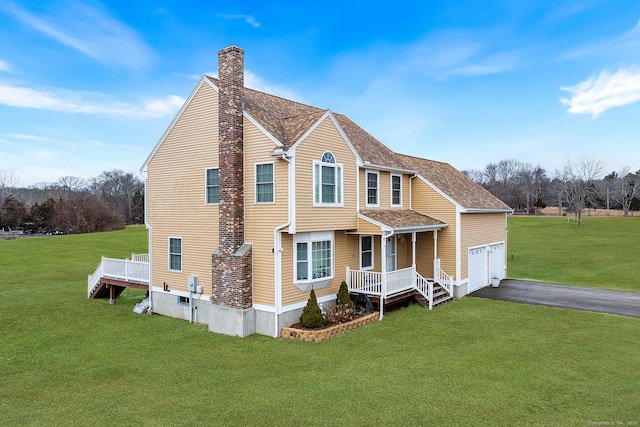 2 Lexington Trl, Salem, CT 06420 - traditional-style house featuring a garage, a front yard, driveway, and a chimney