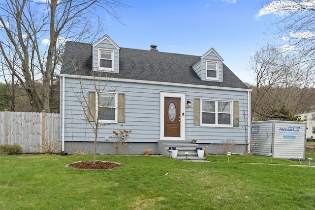 cape cod home featuring a front yard, entry steps, a chimney, and fence
