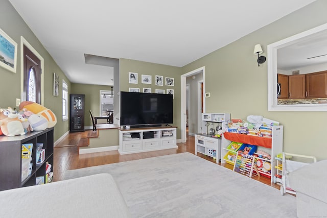 living room featuring wood finished floors and baseboards