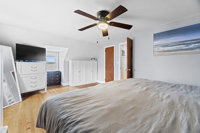bedroom with a ceiling fan and wood finished floors