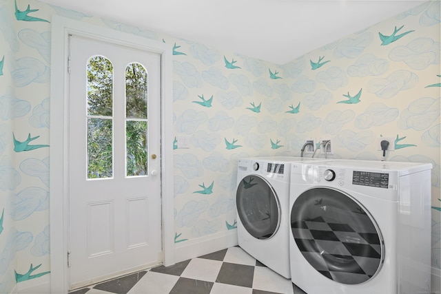 laundry area with laundry area, baseboards, wallpapered walls, tile patterned floors, and washing machine and clothes dryer