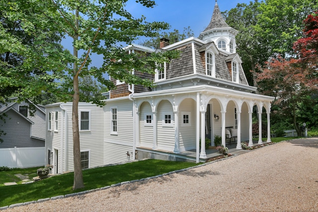 66 Seminary St, New Canaan, CT 06840 - view of property exterior with a porch and a chimney