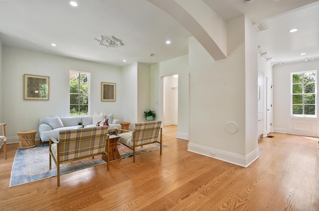 66 Seminary St, New Canaan, CT 06840 - living room featuring arched walkways, light wood-style floors, and recessed lighting