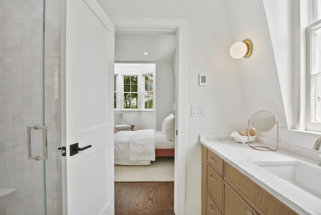 66 Seminary St, New Canaan, CT 06840 - ensuite bathroom with vanity, a stall shower, and wood finished floors