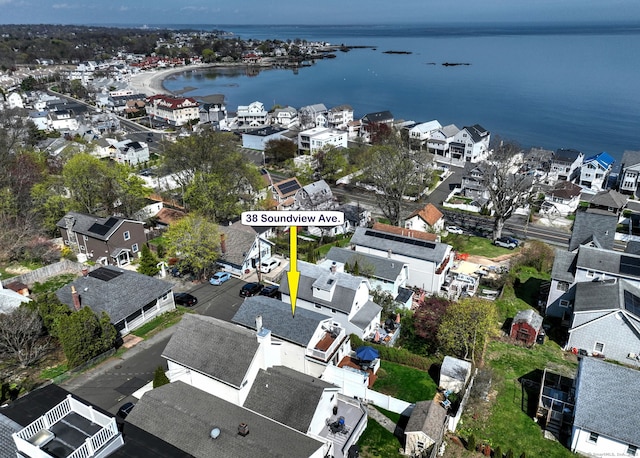 birds eye view of property featuring a residential view and a water view