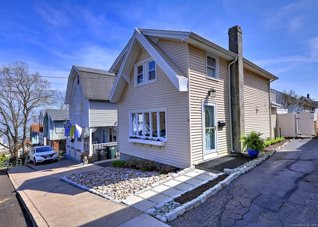 exterior space with a chimney and a porch