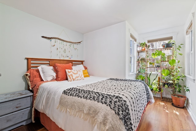 bedroom with wood finished floors