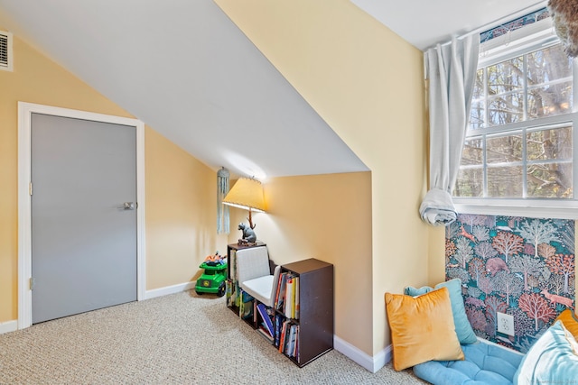 interior space with baseboards and carpet