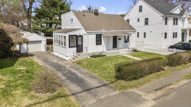 449 High St, Fairfield, CT 06824 - view of front of home with roof with shingles, an outbuilding, a detached garage, a chimney, and fence