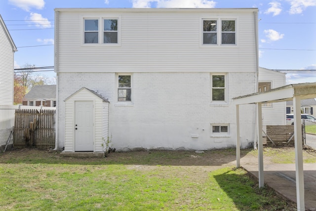 449 High St, Fairfield, CT 06824 - rear view of property featuring brick siding, a lawn, and fence