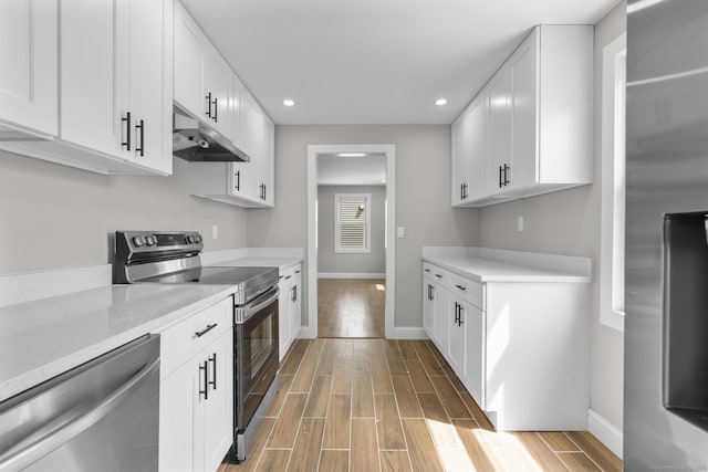 449 High St, Fairfield, CT 06824 - kitchen with baseboards, under cabinet range hood, stainless steel appliances, and recessed lighting