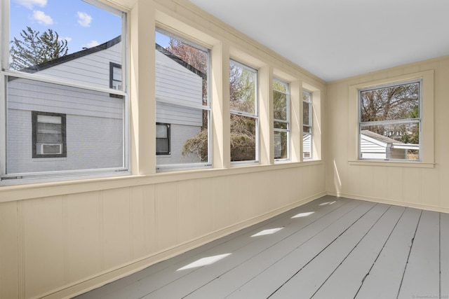 449 High St, Fairfield, CT 06824 - unfurnished sunroom with wood-type flooring and a decorative wall