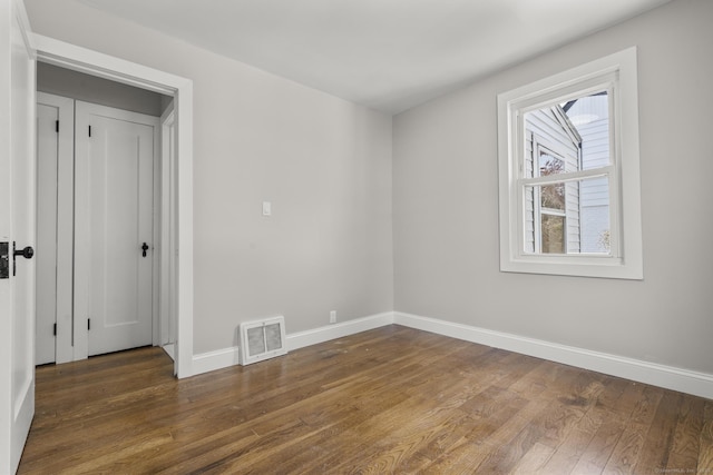 449 High St, Fairfield, CT 06824 - spare room featuring baseboards, wood finished floors, and visible vents