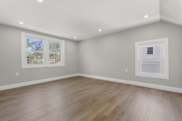 449 High St, Fairfield, CT 06824 - unfurnished room featuring lofted ceiling, baseboards, wood finished floors, and recessed lighting
