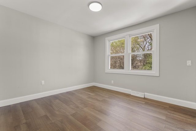 449 High St, Fairfield, CT 06824 - spare room featuring baseboards, wood finished floors, and visible vents
