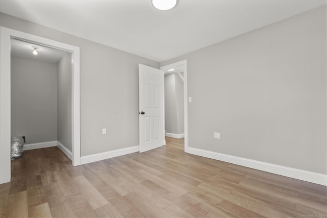 449 High St, Fairfield, CT 06824 - unfurnished bedroom with light wood finished floors and baseboards