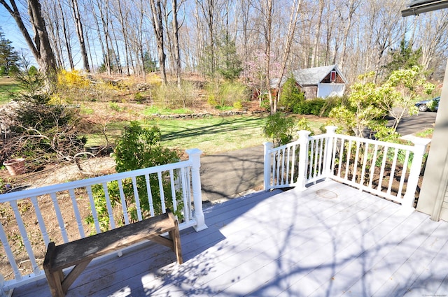 wooden terrace with an outbuilding