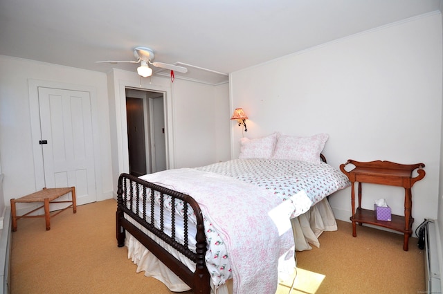 bedroom with ceiling fan, light carpet, a closet, and crown molding