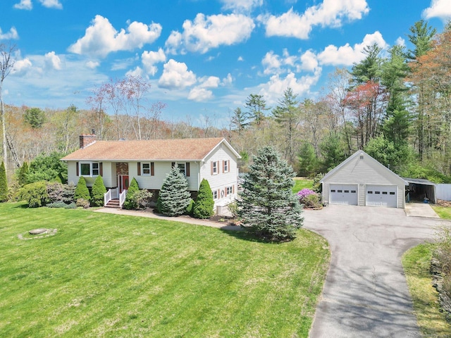 view of front of home with a detached garage, a chimney, an outdoor structure, and a front lawn