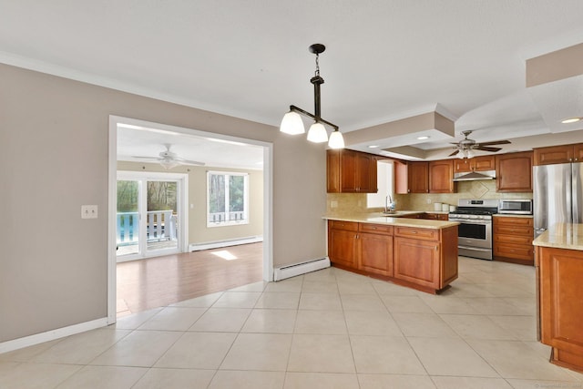 kitchen featuring a baseboard radiator, a ceiling fan, baseboard heating, and stainless steel appliances