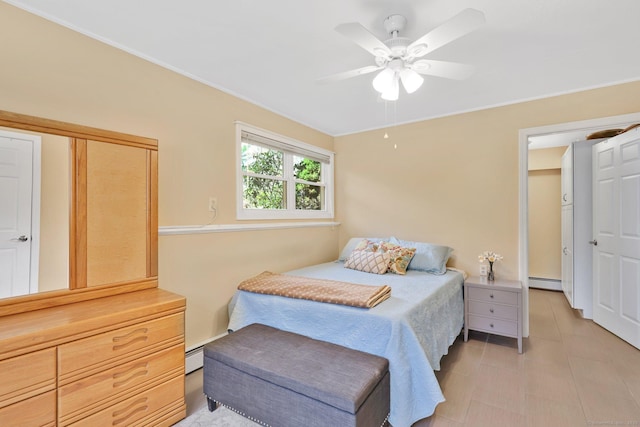 bedroom with crown molding, a ceiling fan, and baseboard heating