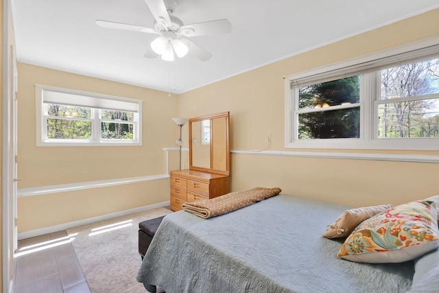 bedroom with baseboards, carpet flooring, and ceiling fan