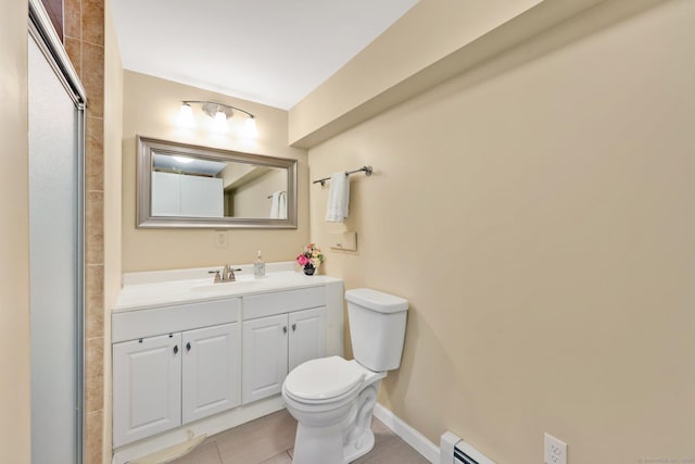 bathroom with vanity, baseboards, and toilet