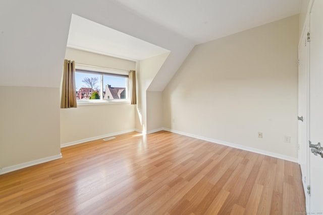 72 Montoya Dr Unit 72, Branford, CT 06405 - additional living space featuring visible vents, vaulted ceiling, baseboards, and light wood-style flooring